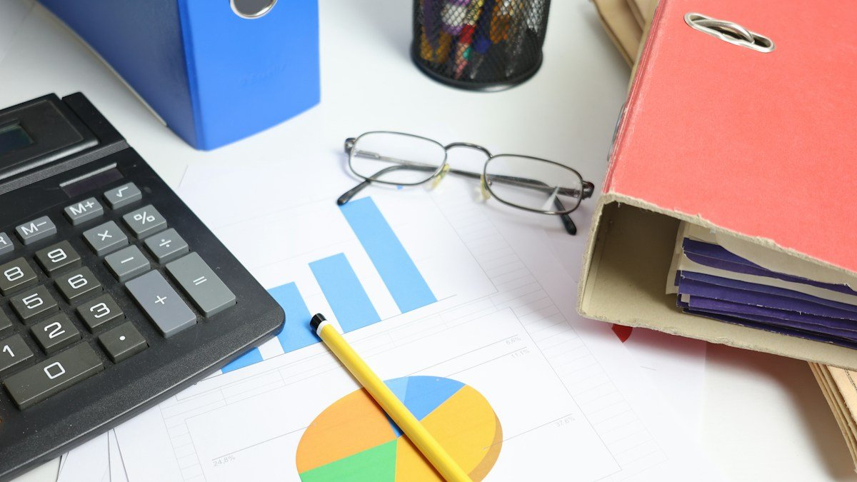 Break-even analysis for small businesses with calculator and financial charts