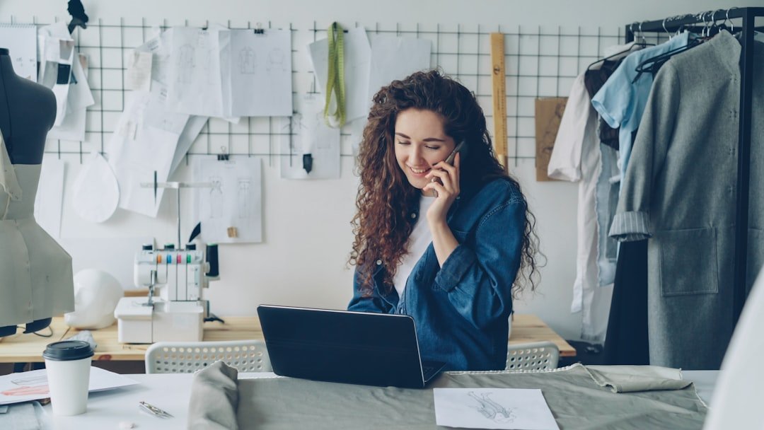 Small business owner managing an online business profile on a laptop