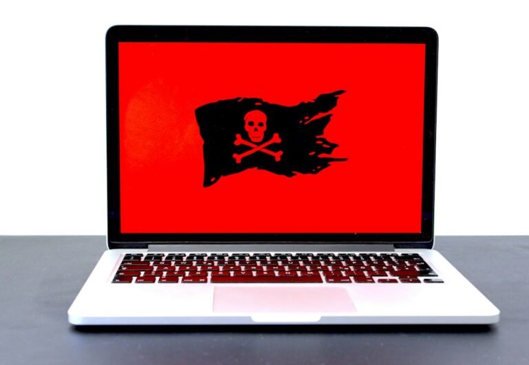 Laptop with red warning screen representing Google September 2026 spam update and search spam risks