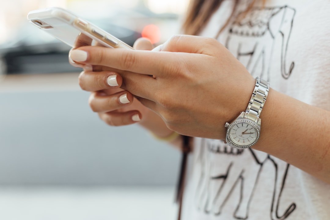 Customer using a smartphone to read and manage online business reviews